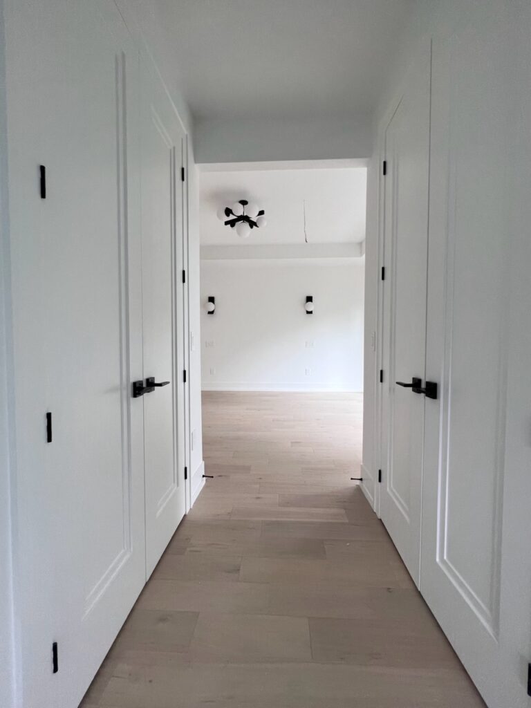 Upstairs hallway with two build-in closets.
