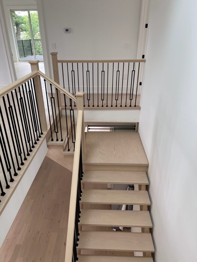 A staircase to the second floor in a custom home.
